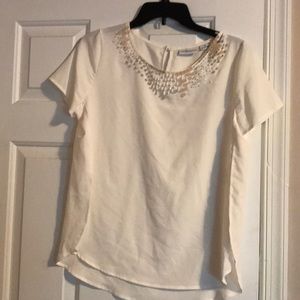 Cream colored blouse with beading